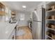 Bright kitchen featuring wooden shelves, stainless steel appliances, and ample counter space at 1786 Richard Ne Rd, Conyers, GA 30012