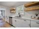 Well-lit kitchen featuring white cabinets, quartz countertops, and stainless steel appliances at 1786 Richard Ne Rd, Conyers, GA 30012