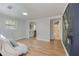 Bright living room featuring hardwood floors, natural light and openings to the kitchen and bathroom at 1786 Richard Ne Rd, Conyers, GA 30012