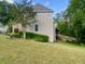 Well-maintained backyard with a lush lawn and manicured landscaping at 2002 Fairbrook Ln, Woodstock, GA 30189