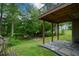 The backyard has an under-deck patio area, as well as an upper deck and wooded area at 2002 Fairbrook Ln, Woodstock, GA 30189