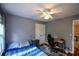Bedroom features hardwood floors, natural light, a ceiling fan, and closet at 2002 Fairbrook Ln, Woodstock, GA 30189