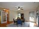 Dining room with hardwood floors, ceiling fan, area rug and natural light at 2002 Fairbrook Ln, Woodstock, GA 30189