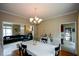 Inviting dining room with table, chandelier, and view to living room at 2002 Fairbrook Ln, Woodstock, GA 30189