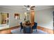Dining room featuring hardwood floors with a view of the kitchen and staircase at 2002 Fairbrook Ln, Woodstock, GA 30189