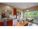 Charming kitchen featuring an adjacent breakfast nook with views of the backyard at 2002 Fairbrook Ln, Woodstock, GA 30189