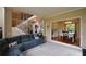 Open living room with staircase, and open access to the kitchen and dining room at 2002 Fairbrook Ln, Woodstock, GA 30189
