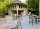 Community pool house featuring outdoor seating and tables for residents at 2002 Fairbrook Ln, Woodstock, GA 30189