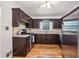 Well-equipped kitchen with dark wood cabinetry, granite countertops, and stainless steel appliances at 2381 Woodacres Ne Rd, Atlanta, GA 30345
