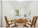 Bright home office with hardwood floors, modern desk, and a pair of accent chairs at 2381 Woodacres Ne Rd, Atlanta, GA 30345