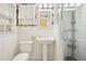 Classic bathroom featuring a pedestal sink, floral wallpaper, and walk-in shower at 2381 Woodacres Rd, Atlanta, GA 30345
