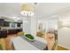 Dining room featuring hardwood floors, a stylish chandelier, and an open floor plan at 2381 Woodacres Rd, Atlanta, GA 30345
