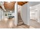 Basement staircase leading to a rec room and bathroom with gray tile floors at 3106 Soldier Trl, Marietta, GA 30068