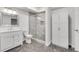 Updated bathroom featuring a glass shower and white vanity with lots of storage at 3106 Soldier Trl, Marietta, GA 30068