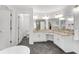 Bright bathroom with double vanity, granite countertops, and a free-standing tub at 3106 Soldier Trl, Marietta, GA 30068