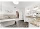 Elegant bathroom with stand-alone tub, granite countertops, and tiled accent wall at 3106 Soldier Trl, Marietta, GA 30068