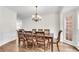 Dining room featuring hardwood floors, decorative wainscoting, and a chandelier at 3106 Soldier Trl, Marietta, GA 30068