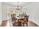 Dining room featuring hardwood floors, decorative wainscoting, and a bay window at 3106 Soldier Trl, Marietta, GA 30068