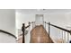 Upper hallway with hardwood floors and railing overlooking other parts of the home at 3106 Soldier Trl, Marietta, GA 30068