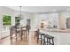 Bright kitchen featuring white cabinets, stainless steel appliances, granite countertops, and an adjacent breakfast nook at 3106 Soldier Trl, Marietta, GA 30068