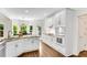 Charming kitchen with white cabinets, granite countertops, stainless steel appliances, and a sunlit breakfast nook at 3106 Soldier Trl, Marietta, GA 30068