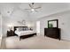 Spacious main bedroom with trey ceiling, fan, neutral carpet, and dark wood furniture at 3106 Soldier Trl, Marietta, GA 30068