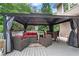 Outdoor deck with a gazebo, cozy seating, a coffee table, and outdoor chairs for relaxing and entertaining at 3106 Soldier Trl, Marietta, GA 30068