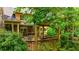 Outdoor living space with a charming pergola-covered deck, perfect for relaxation and entertaining in a private backyard at 3358 Stovehill Se Ct, Marietta, GA 30067