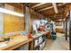 Unfinished basement featuring a workbench, ideal for a workshop or ample storage space with exposed beams at 3358 Stovehill Se Ct, Marietta, GA 30067