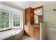 Well lit bathroom with wood cabinets, granite counters, a soaking tub and glass enclosed shower at 3358 Stovehill Se Ct, Marietta, GA 30067