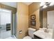 Bathroom featuring a walk-in shower, vanity with sink, and decorative artwork for a tranquil feel at 3358 Stovehill Se Ct, Marietta, GA 30067