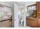 Bathroom featuring granite vanity with double sinks and access to the primary bedroom at 3358 Stovehill Se Ct, Marietta, GA 30067