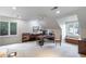 Bonus room with large windows, neutral carpet, desk, and ceiling fan at 3358 Stovehill Se Ct, Marietta, GA 30067
