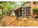 Expansive wooden deck with screened porch, pergola, and built-in planters for outdoor living and entertainment at 3358 Stovehill Se Ct, Marietta, GA 30067