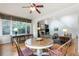 Charming dining area with hardwood floors, a bright window, and views into the living room at 3358 Stovehill Se Ct, Marietta, GA 30067