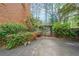 Private driveway framed by lush greenery, offering a tranquil entrance to the property and backyard at 3358 Stovehill Se Ct, Marietta, GA 30067