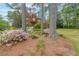 Stately two-story brick home with lush landscaping, mature trees and colorful azaleas at 3358 Stovehill Se Ct, Marietta, GA 30067