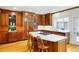 Spacious kitchen with custom wood cabinetry, stainless steel appliances, and center island with cooktop at 3358 Stovehill Se Ct, Marietta, GA 30067