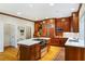 Gourmet kitchen with a central island, stainless steel appliances, and custom cherry wood cabinetry at 3358 Stovehill Se Ct, Marietta, GA 30067