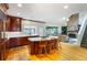 Spacious kitchen with a large island, wooden cabinetry, hardwood floors, and open access to living spaces at 3358 Stovehill Se Ct, Marietta, GA 30067