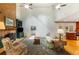 Open living room with hardwood floors, brick fireplace, built-in shelving, and large windows at 3358 Stovehill Se Ct, Marietta, GA 30067