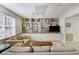 Inviting living room with a plush sofa, large window, and built-in shelving for a cozy atmosphere at 3358 Stovehill Se Ct, Marietta, GA 30067