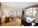 Spacious office featuring natural light, hardwood floors, and a classic desk setup at 3358 Stovehill Se Ct, Marietta, GA 30067