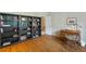 Office space with wood floors, large bookshelves, neutral walls, desk, and chair at 3358 Stovehill Se Ct, Marietta, GA 30067