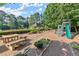 Community playground area with play structures and seating, fostering outdoor fun and social interaction at 3358 Stovehill Se Ct, Marietta, GA 30067