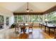 Inviting sunroom with abundant windows and a charming dining set at 3358 Stovehill Se Ct, Marietta, GA 30067