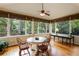 Bright sunroom featuring large windows offering beautiful views of the surrounding greenery at 3358 Stovehill Se Ct, Marietta, GA 30067