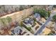 A high angle of a beautiful landscaped home and yard near the local golf course at 5560 Stoneleigh Dr, Suwanee, GA 30024
