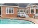 Covered patio with outdoor grill, lounge furniture and nice landscaping near the swimming pool at 5560 Stoneleigh Dr, Suwanee, GA 30024