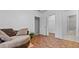 Bedroom featuring unique brick-style flooring, a cozy sitting area, and bright, white trim at 5560 Stoneleigh Dr, Suwanee, GA 30024